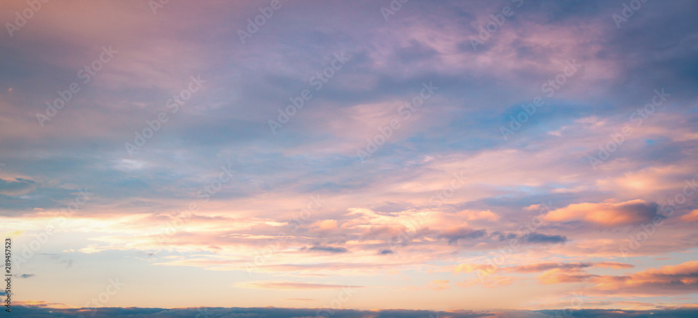 Dramatic sun ray with orange sky and clouds dawn texture background