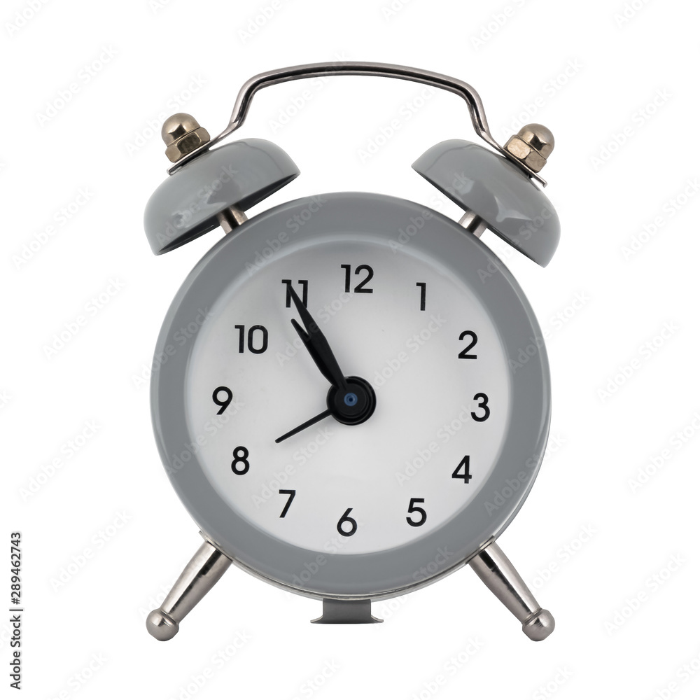 A gray clock with an alarm clock on a white background with arrows showing the time ten hours fifty five minutes or twenty two hours fifty five minutes A gray clock with an alarm clock on a white background with arrows showing the time ten hours fifty five minutes or twenty two hours fifty five minutes