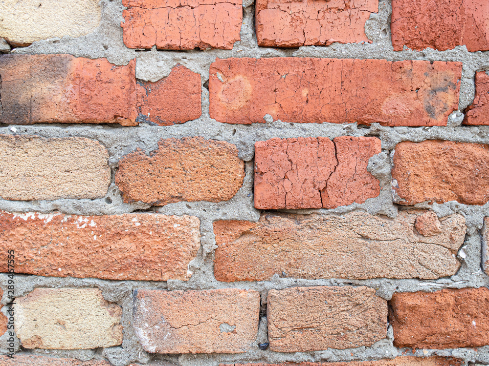 Old dirty brickwork wall. Background texture. Scratches and bumps Old dirty brickwork wall. Background texture. Scratches and bumps