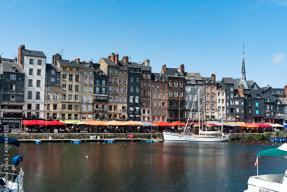 the old port and reataurant district in the historic city of Honfleur in Normandy