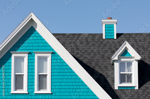 Roof and gables detail in turquoise  white and blue