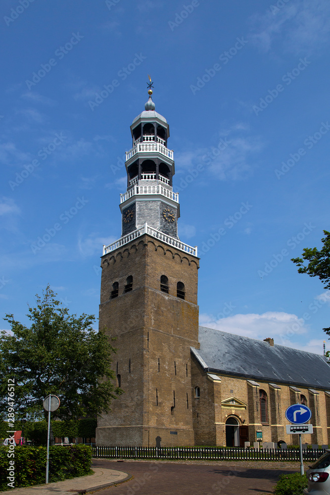Fototapeta premium Monumental tower of church in Dutch city Hindeloopen