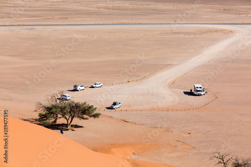 Parking area in front of Dune 45 with off-road vehicles, Sossusvlei, Namib Naukluft Park, Namibia