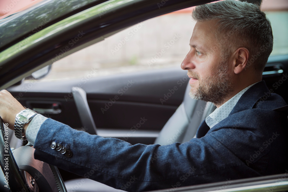 man driver sitting in the car and drive