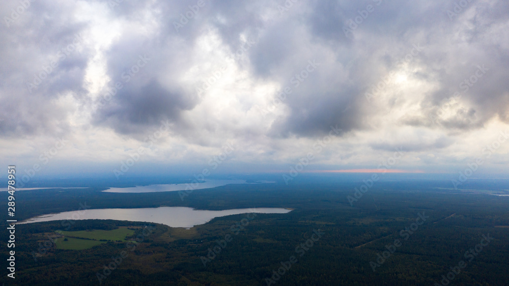 Aerial image of dark Storm clouds over the land. Aerial panorama of storm clouds. Panorama of thunder clouds. View from drone. Aerial bird's eye view. Aerial top view cloudscape. Texture of clouds.