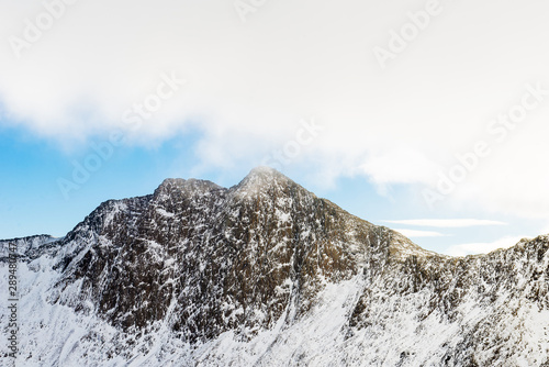 Snow covered mountain range in snowdonia, wales, United Kingdom.