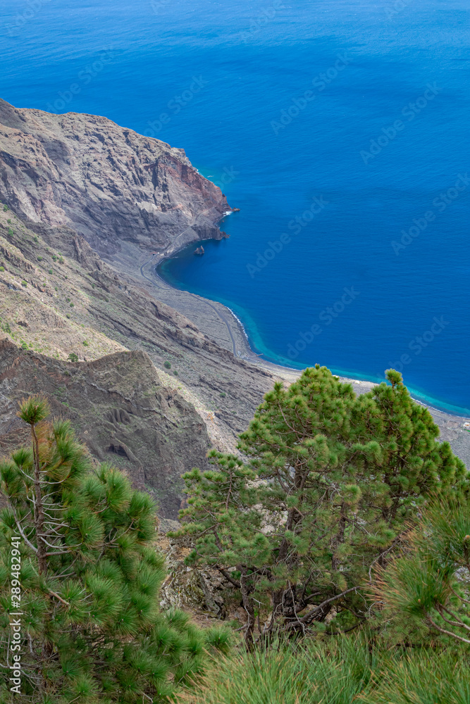 Las playas viewpoint, with pine trees and cliff view, and Atlantic ocean background, El Hierro island, Canary islands, Spain