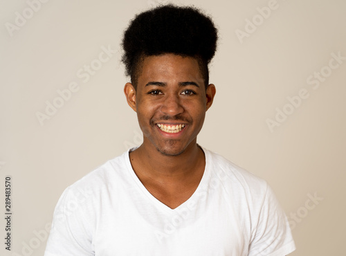 Smiling and laughing attractive african american man in happy face human emotion and expression