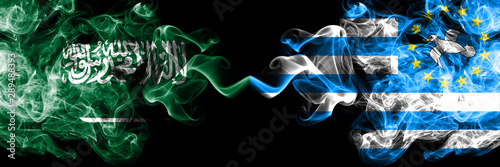 Saudi Arabia Kingdom vs South Cameroon smoky mystic flags placed side by side. Thick colored silky smoke flags of Arabic, Arabian and South Cameroon photo