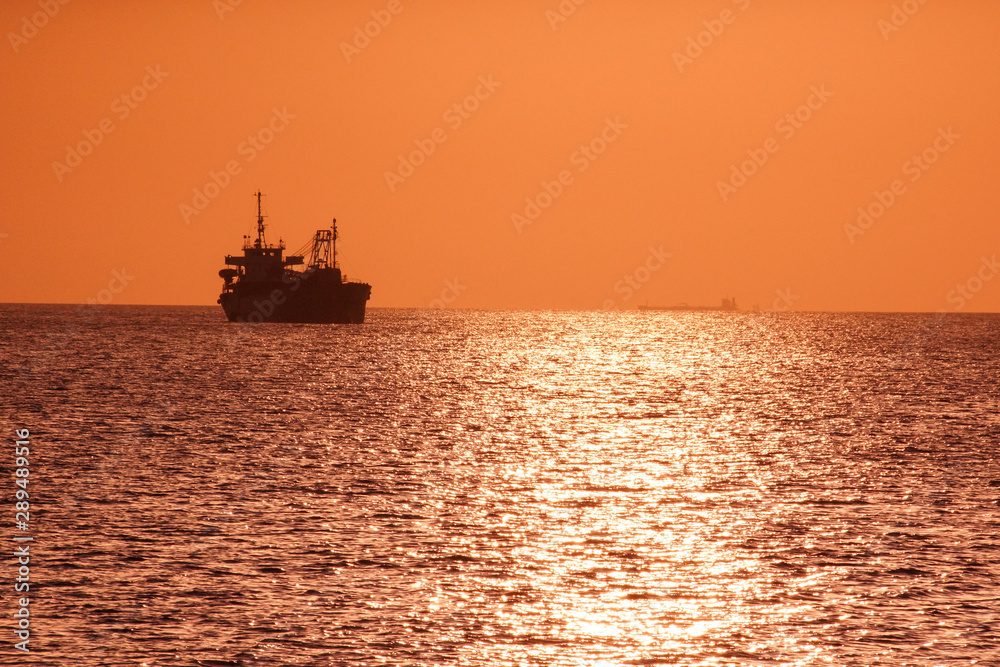 Ship silhouette and sunset