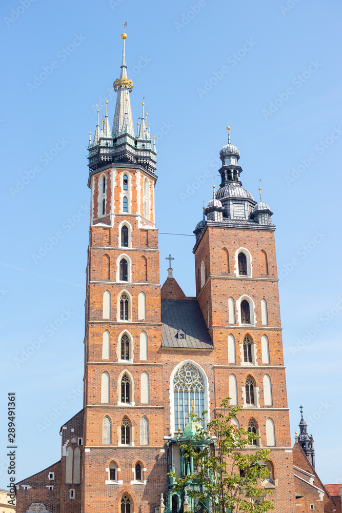 St. Mary's basilica in main square of Krakow, main square, famous cathedral in summer day