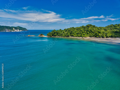Fototapeta Naklejka Na Ścianę i Meble -  Aerial Drone image of The empty but beautiful beaches around the Gulf of Nicoya in Costa Rica with two small tourist boats near the waters edge