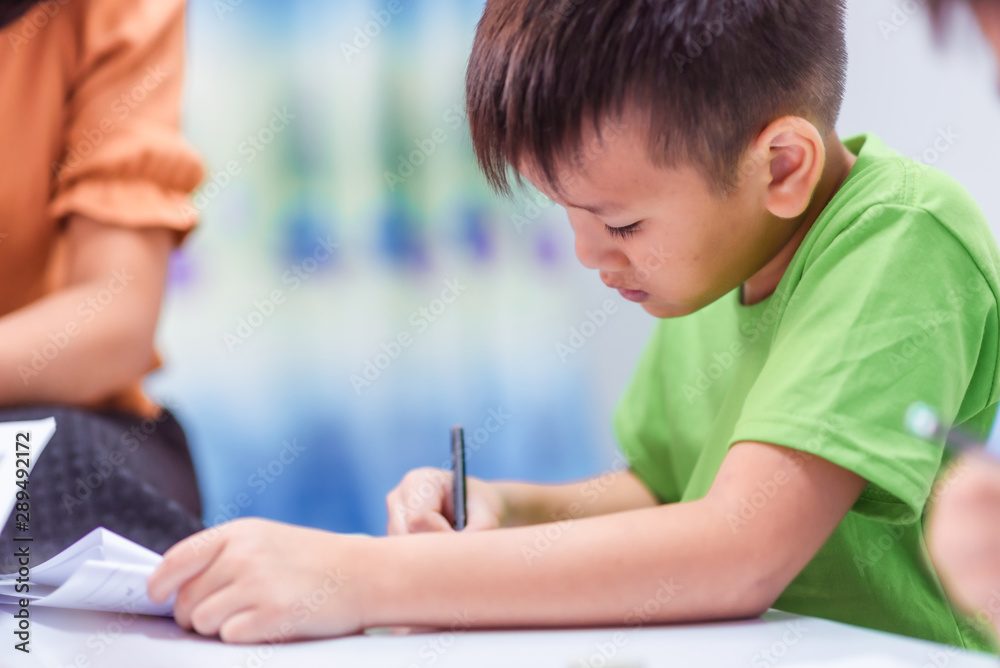 Asian elementary school boy is studying in the classroom. Asian elementary school boy is studying in the classroom.