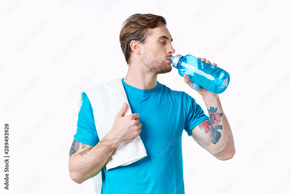 young man with bottle of water isolated on white young man with bottle of water isolated on white