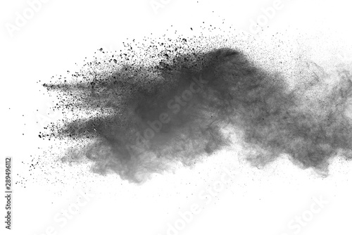 Abstract powder splatted background. Black powder explosion on white background. Colored cloud. 
