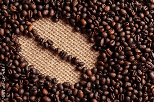 coffee beans on burlap background (ID: 289496555)