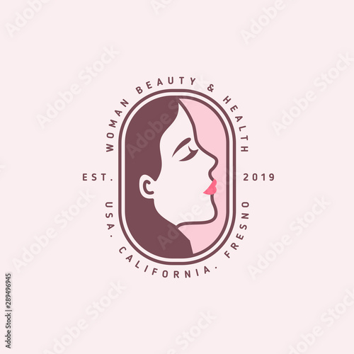 Woman face emblem with text