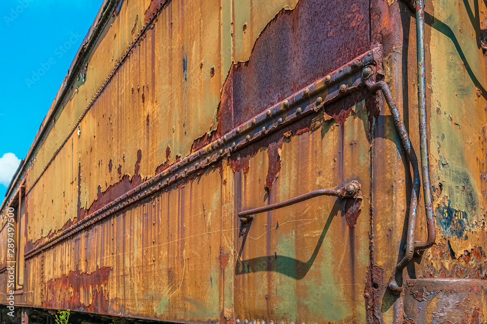 Old Rusty Railroad Car under Blue Sky