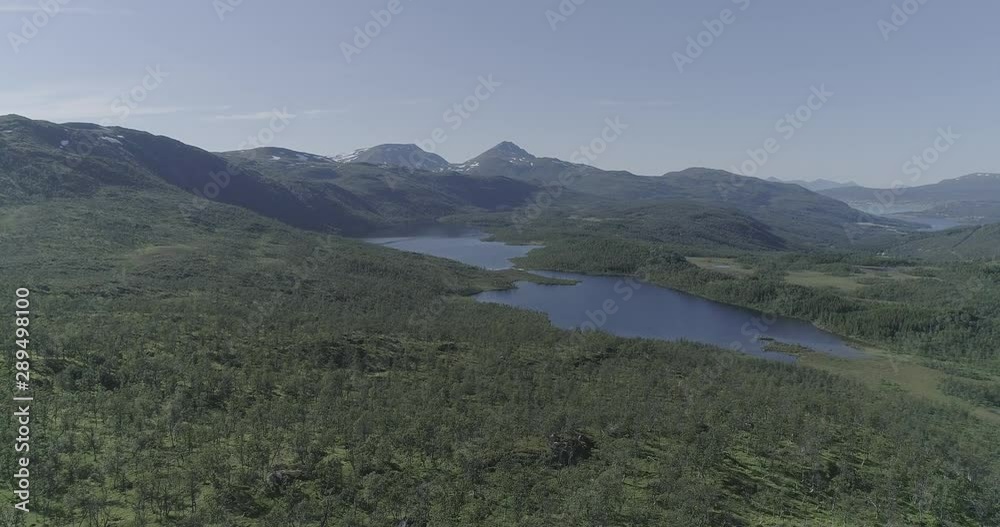 An aerial view of lakes, rivers, forest and mountains in Lapland in the Lofoten Islands in Norway. An aerial view of lakes, rivers, forest and mountains in Lapland in the Lofoten Islands in Norway.