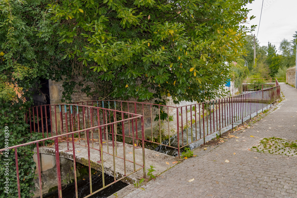 Small footbridge to the entrance of a house on the river Small footbridge to the entrance of a house on the river