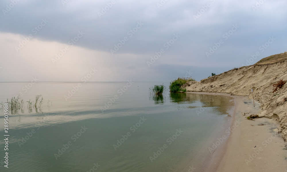 landscape with sea and sand dune shore, shore slip, calm water, Curonian Spit, Nida,, Lithuania. Baltic dunes, UNESCO heritage