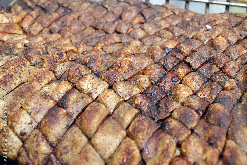 Roasted pork meat. Swine, pig, hog, sow on a barbeque. Grilled meat texture. Meat pattern. Skewer. African swine fever Roasted pork meat. Swine, pig, hog, sow on a barbeque. Grilled meat texture. Meat pattern. Skewer. African swine fever