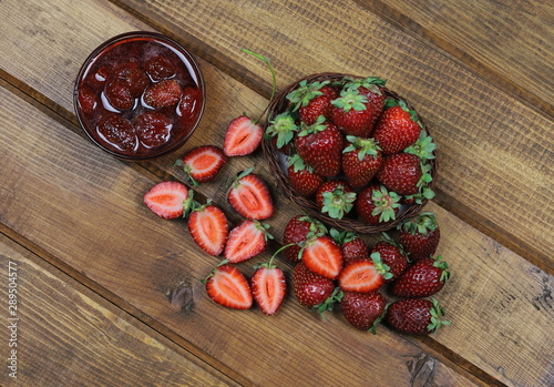  strawberry and strawberry jam in bulk on wooden board