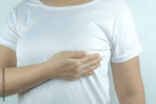 Wallpaper Mural Woman hands doing breast self-exam for checking lumps and signs of breast cancer on white background. Health care and medical concept. Torontodigital.ca
