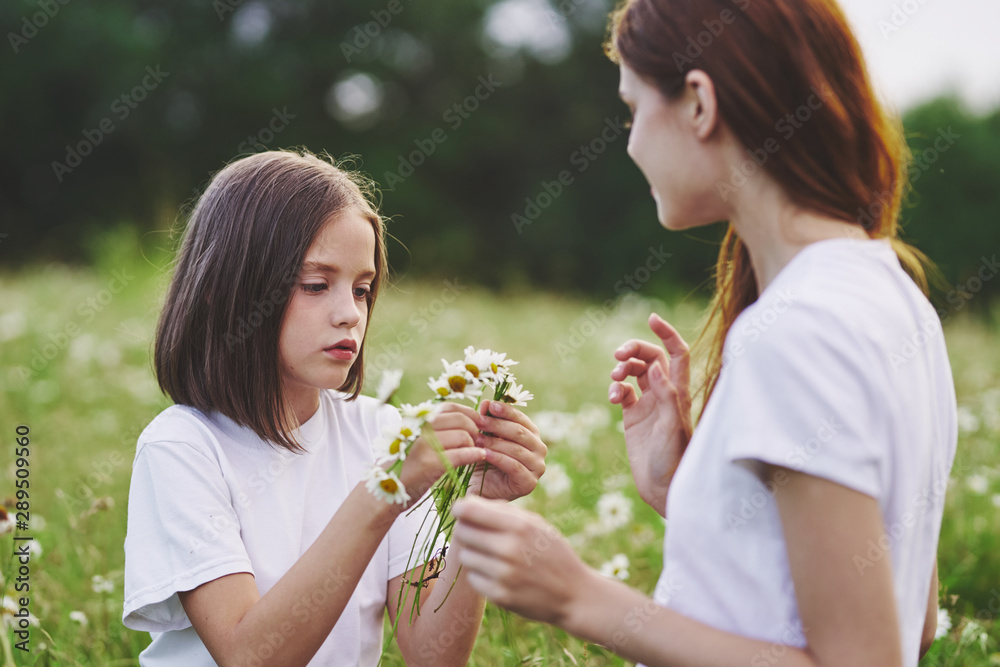 mother and daughter with flowers mother and daughter with flowers