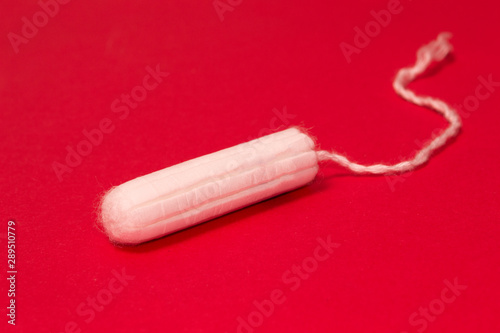 hygienic tampons on a red background, womens health