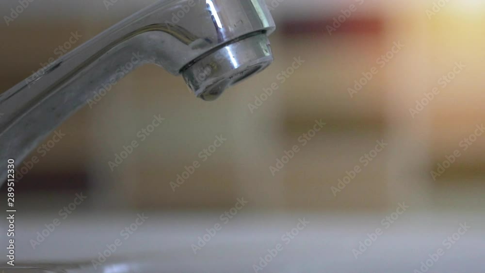 water tap with dripping waterdrop. Water leaking, saving concept water tap with dripping waterdrop. Water leaking, saving concept