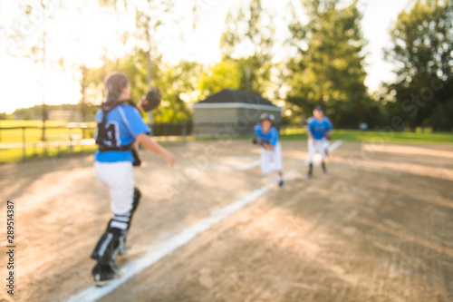 blurred Group of baseball players play together on the playground