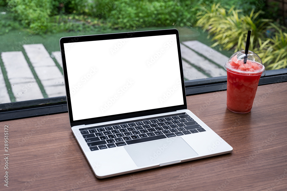 Empty white screen laptop computer on wooden table top, business concept. Mockup design with copy space for text, advertising and banner.