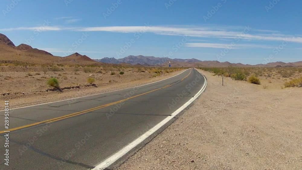 Lonely Deserted Highway In Death Valley CA On Summer Day Lonely Deserted Highway In Death Valley CA On Summer Day
