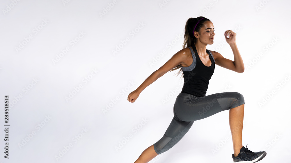 Medium shot woman running indoors Medium shot woman running indoors