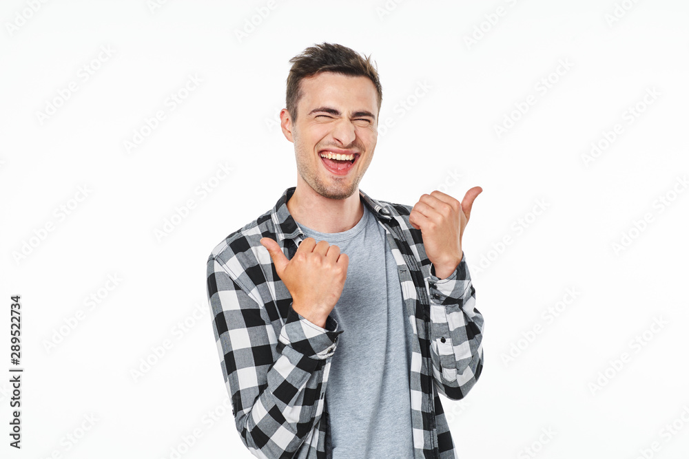 young man pointing at something interesting young man pointing at something interesting