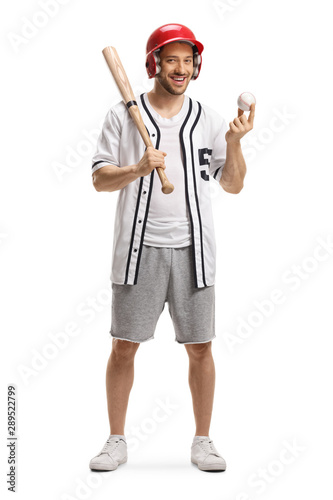 Man holding a baseball bat and ball