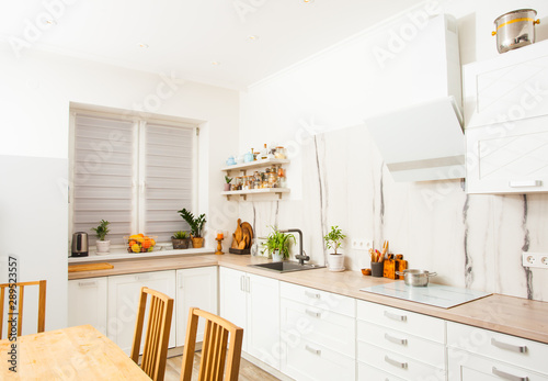 Modern scandinavian kitchen with white open shelves © oksix