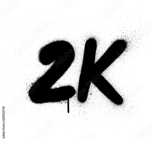 graffiti 2K abbreviation sprayed in black over white