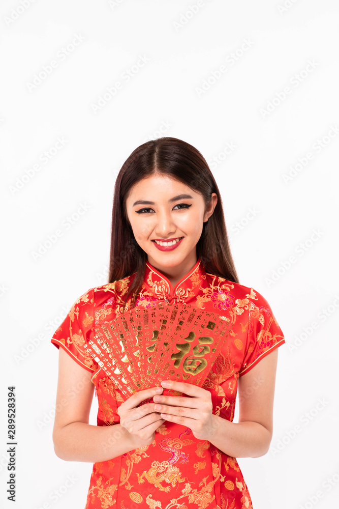 Smiling chinese girl holding red envelope white background Smiling chinese girl holding red envelope white background