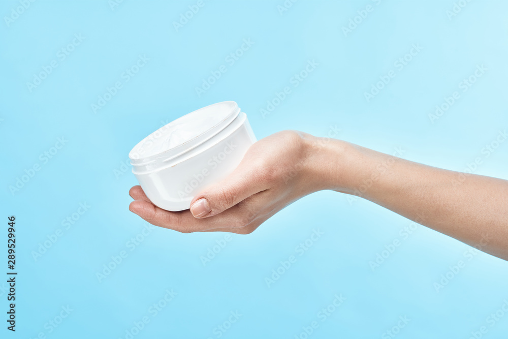 hand with bottle of water isolated on white hand with bottle of water isolated on white