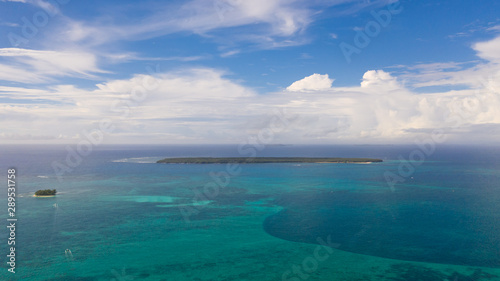 Beautiful seascape. Sea with lagoons and islands  blue sky with big clouds. Philippine nature.