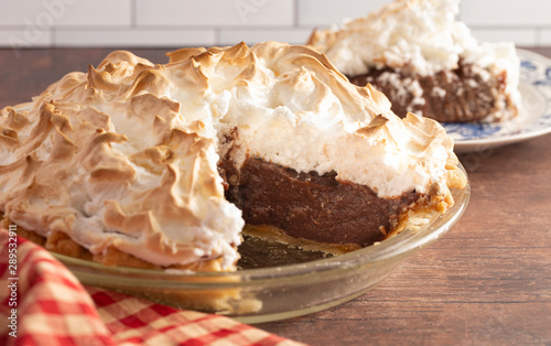 Chocolate Meringue Pie on a Rustic Wooden Table