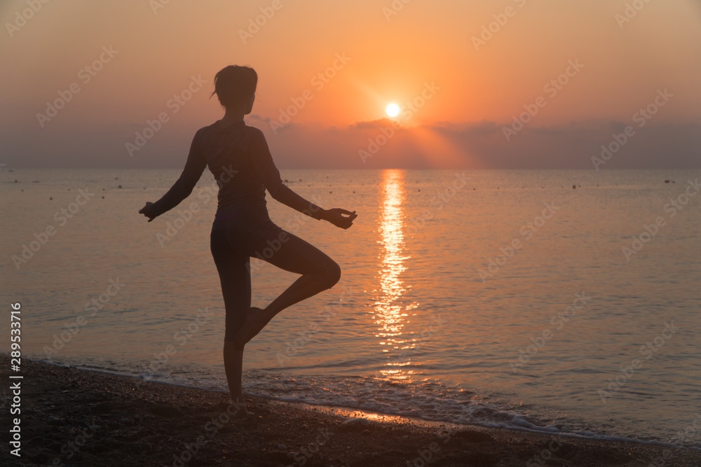  do yoga at dawn. lotus position in the sun