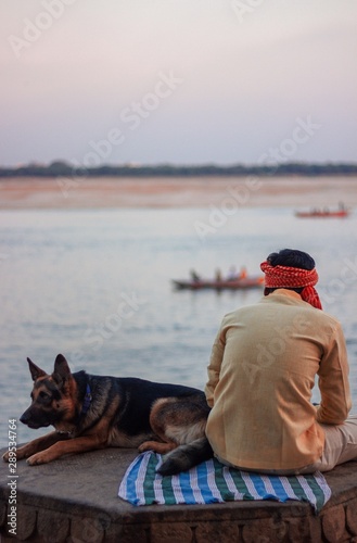 man and dog on the beach