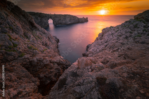 Famous Pont d'en Gil at the west coast of Menorca, Balearic Islands, Spain.