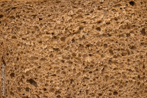 High resolution brown bread texture background. Texture of brown bread baked from rye flour