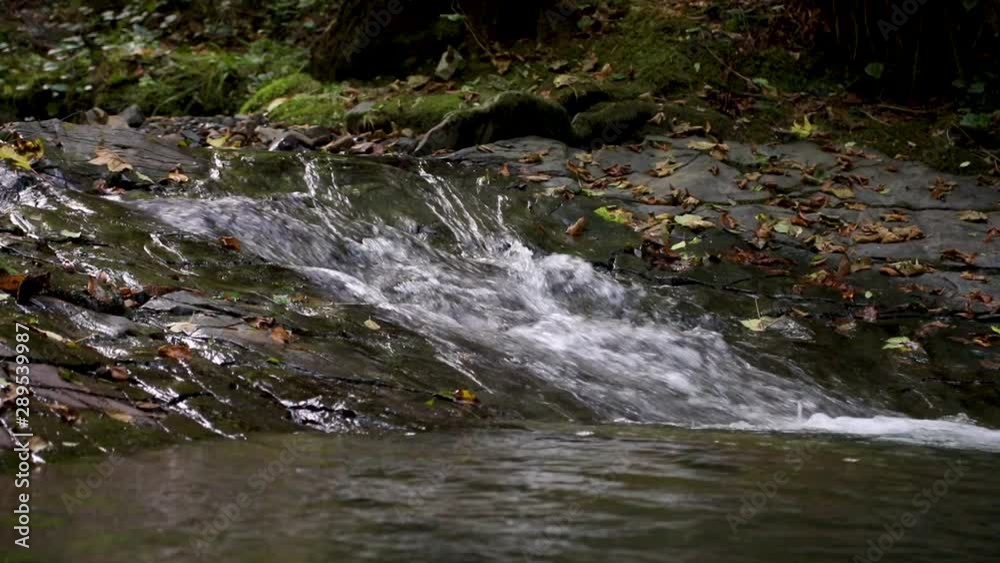 Waterfalls. Several levels of waterfalls. Video with waterfalls. video of flowing water, flowing stream among stones. Stream in the forest Waterfalls. Several levels of waterfalls. Video with waterfalls. video of flowing water, flowing stream among stones. Stream in the forest