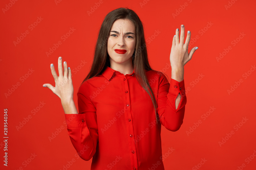 young woman with hands on her head young woman with hands on her head