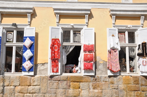 Photos Windows of an old building in Szentendre Hungary with exposed folk handicrafts